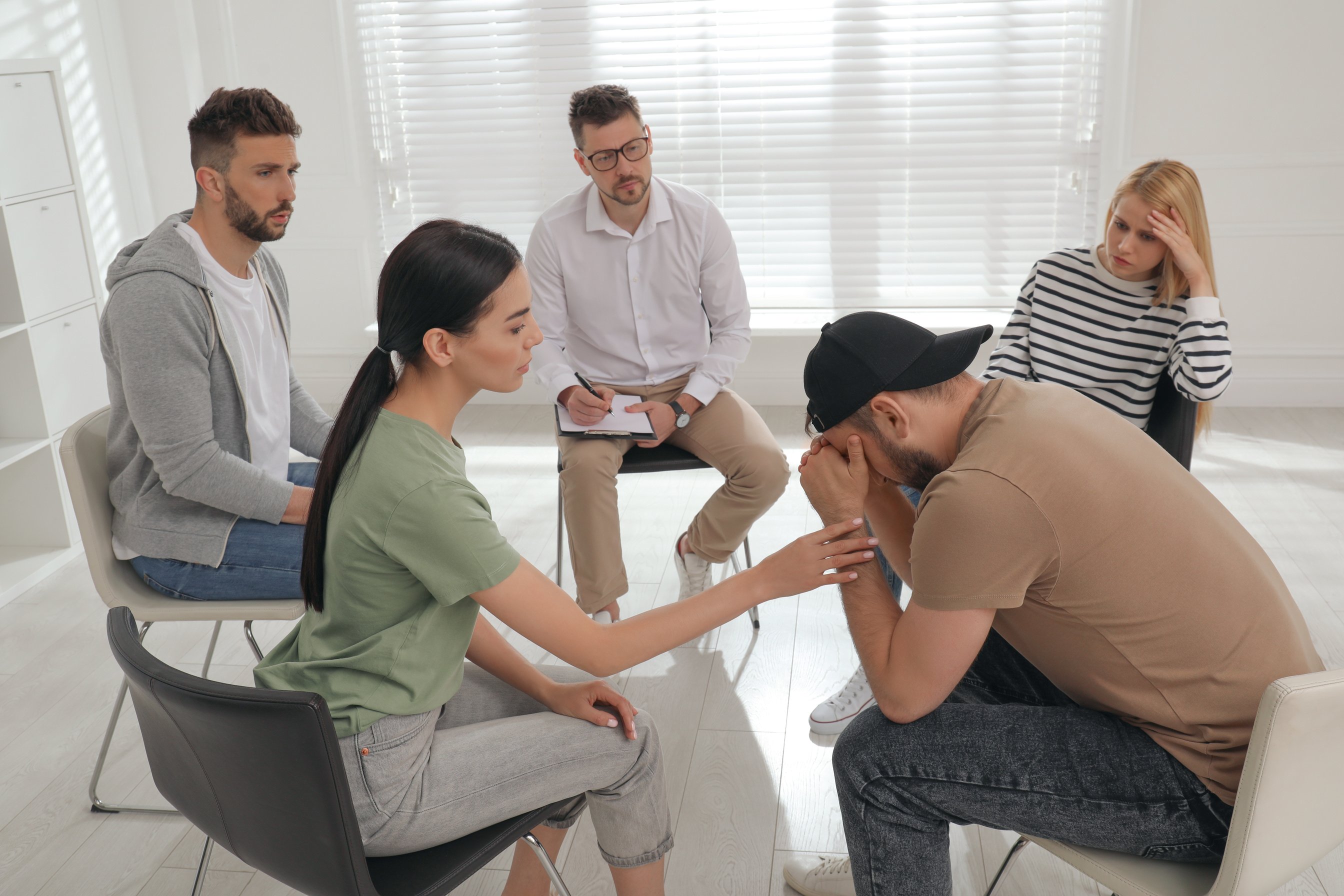 Psychotherapist Working with Group of Drug Addicted People at Th