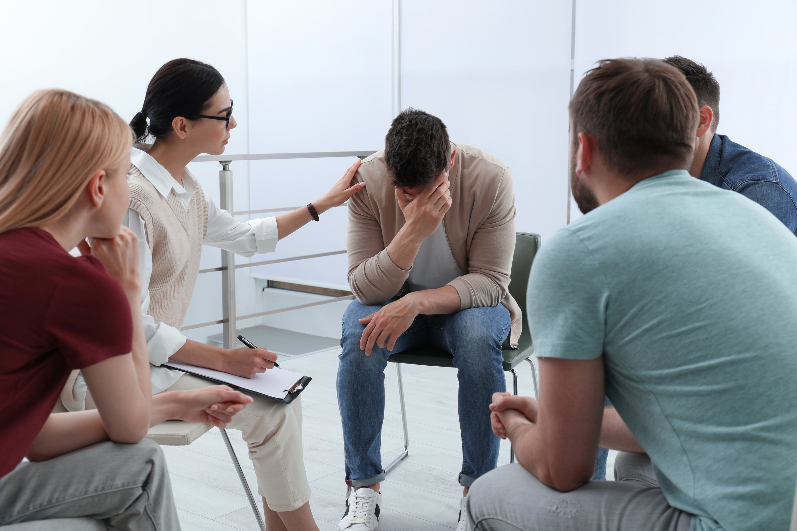 Psychotherapist Working with Group of Drug Addicted People at Th